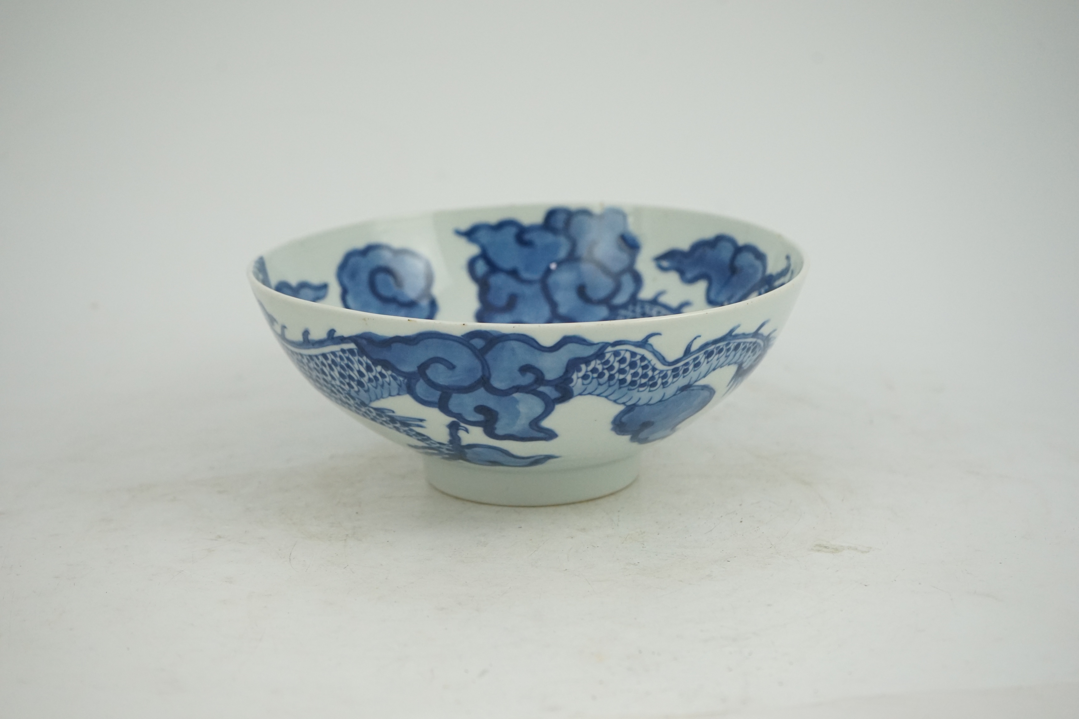 A Chinese blue and white ‘cloud and dragon’ bowl, Yongzheng mark and period (1723-35)